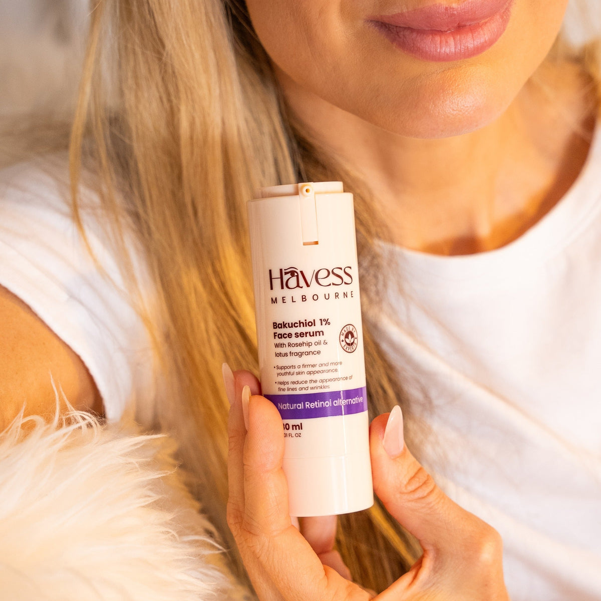 The HAVESS Bakuchiol 1% Face Serum bottle held in hand, label in focus.